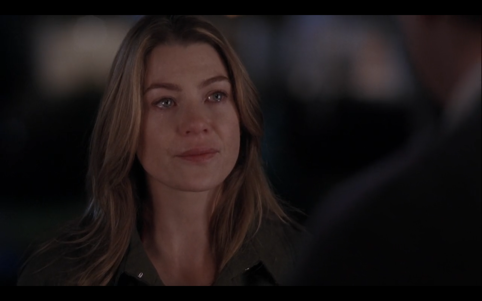 Still from episode 27 of Grey's Anatomy. Meredith Grey is looking disdainfully at someone off-screen, her eyes flooded with tears.