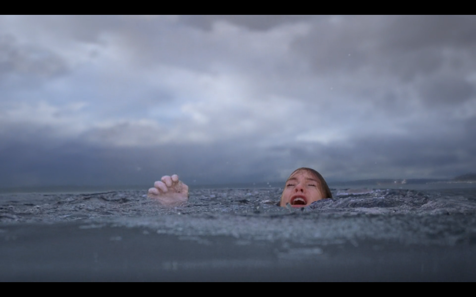 Still from episode 52 of Grey's Anatomy. Meredith Grey is drowning, barely able to keep her head above water.