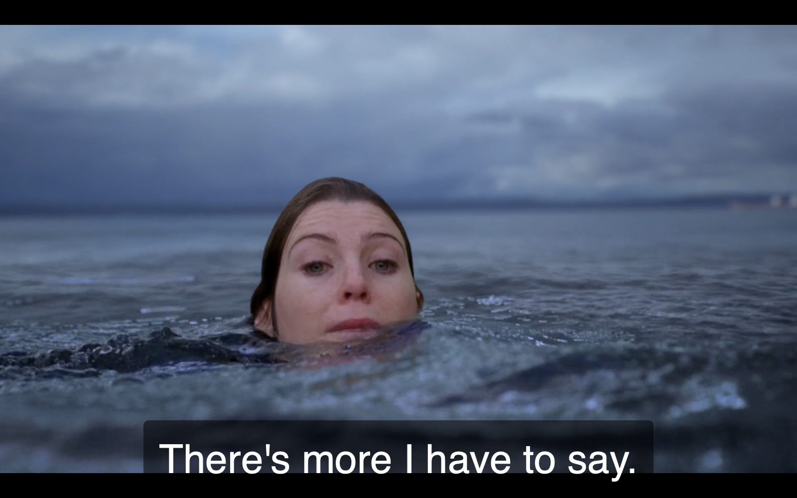 Still from episode 52 of Grey's Anatomy. Meredith Grey, mid-drowning, looks resigned. The show's subtitle reads, "There's more I have to say."