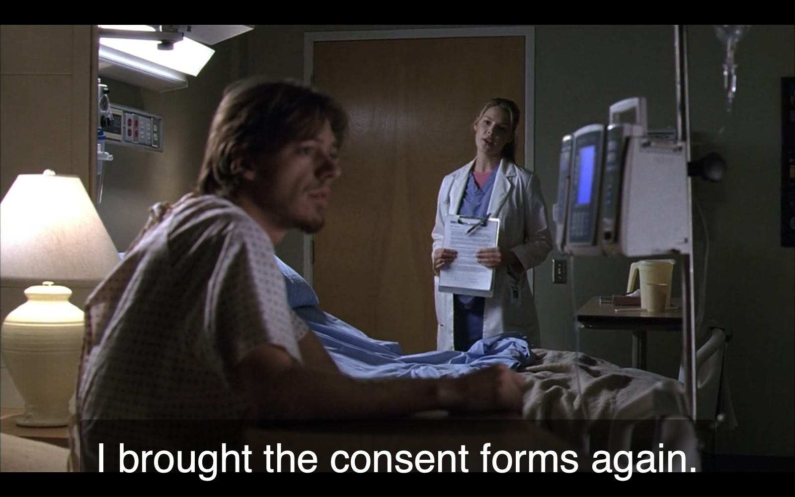 Still from episode 8 of Grey’s Anatomy: a young white female doctor is telling a concerned-looking white male patient, “I brought the consent forms again.”